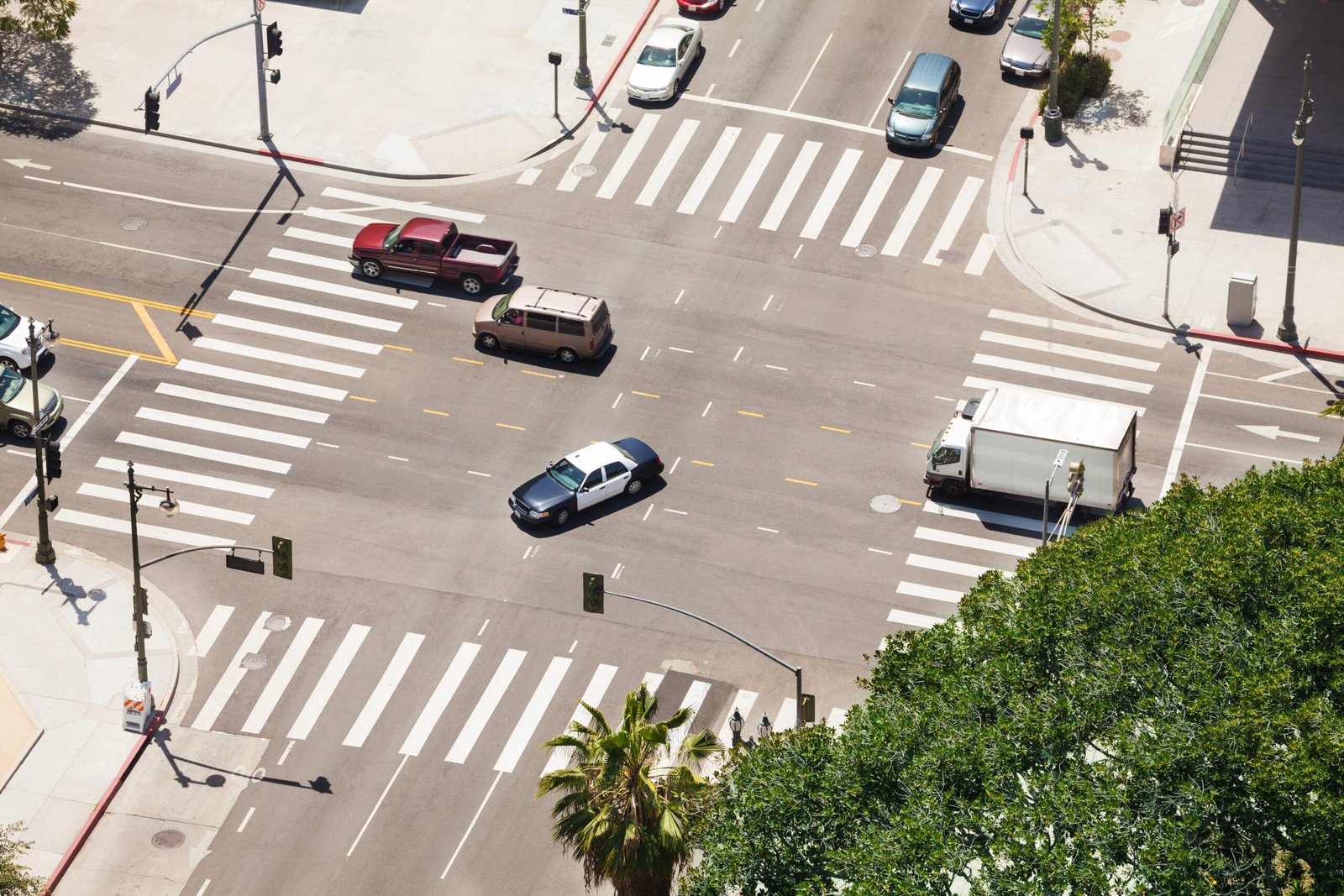View from top of Spring Street and traffic in Los Angeles city during summer sunny day, USA