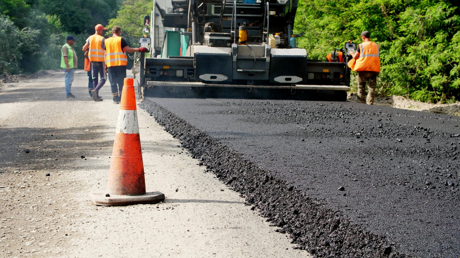 Repair of a highway, Road construction works. workers lay asphalt. There are lots of special equipment, machines for paving asphalt. High quality photo